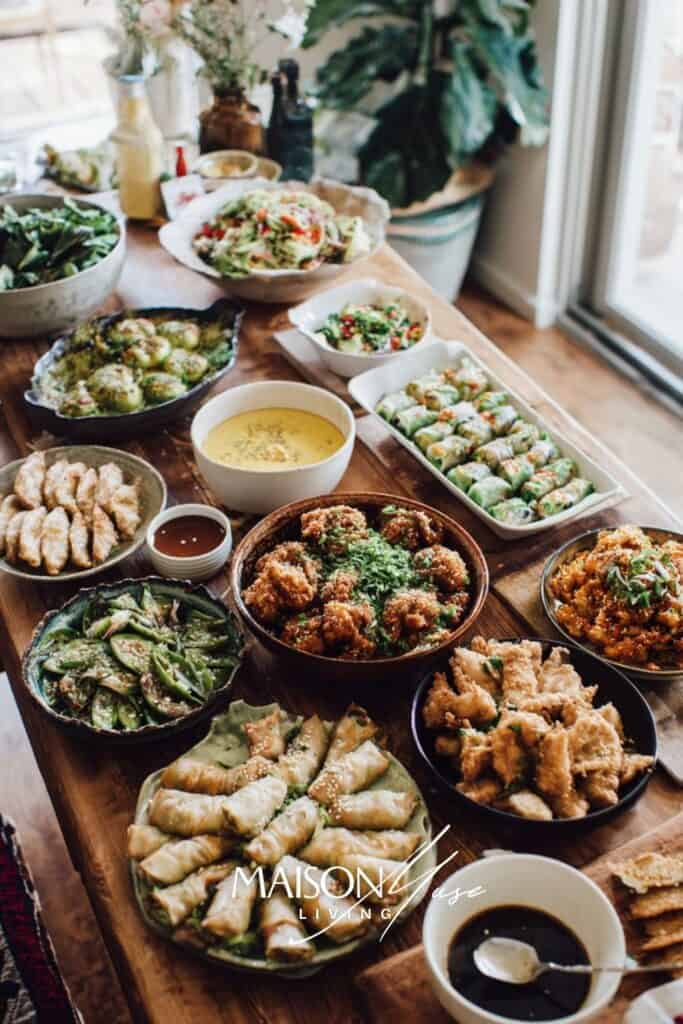 around the world dinner party table with dishes from multiple cultures