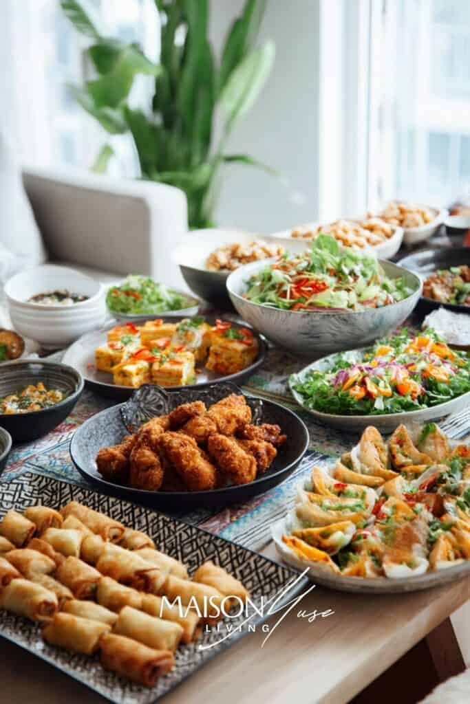 around the world dinner party table with international dishes from multiple cultures