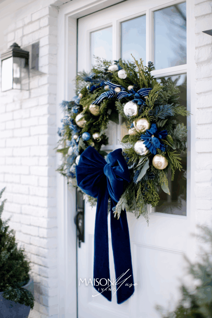 full evergreen Christmas wreath with navy and gold accents