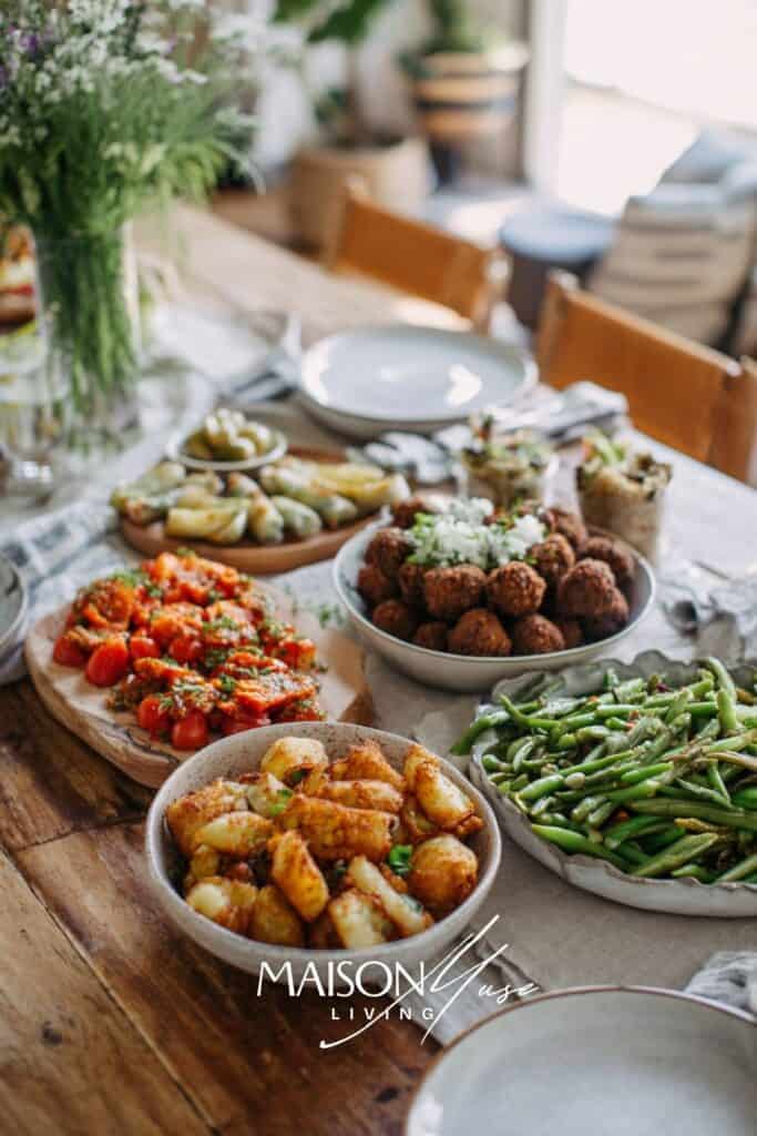 dinner party table with global tapas plates